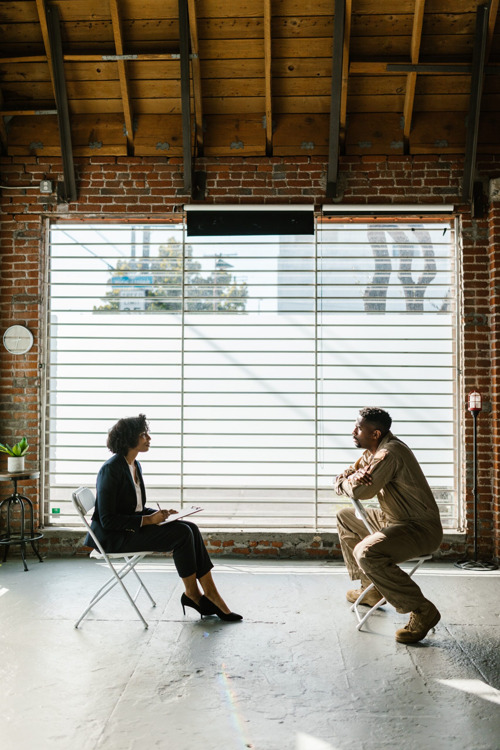 man explaining to woman in a therapy session